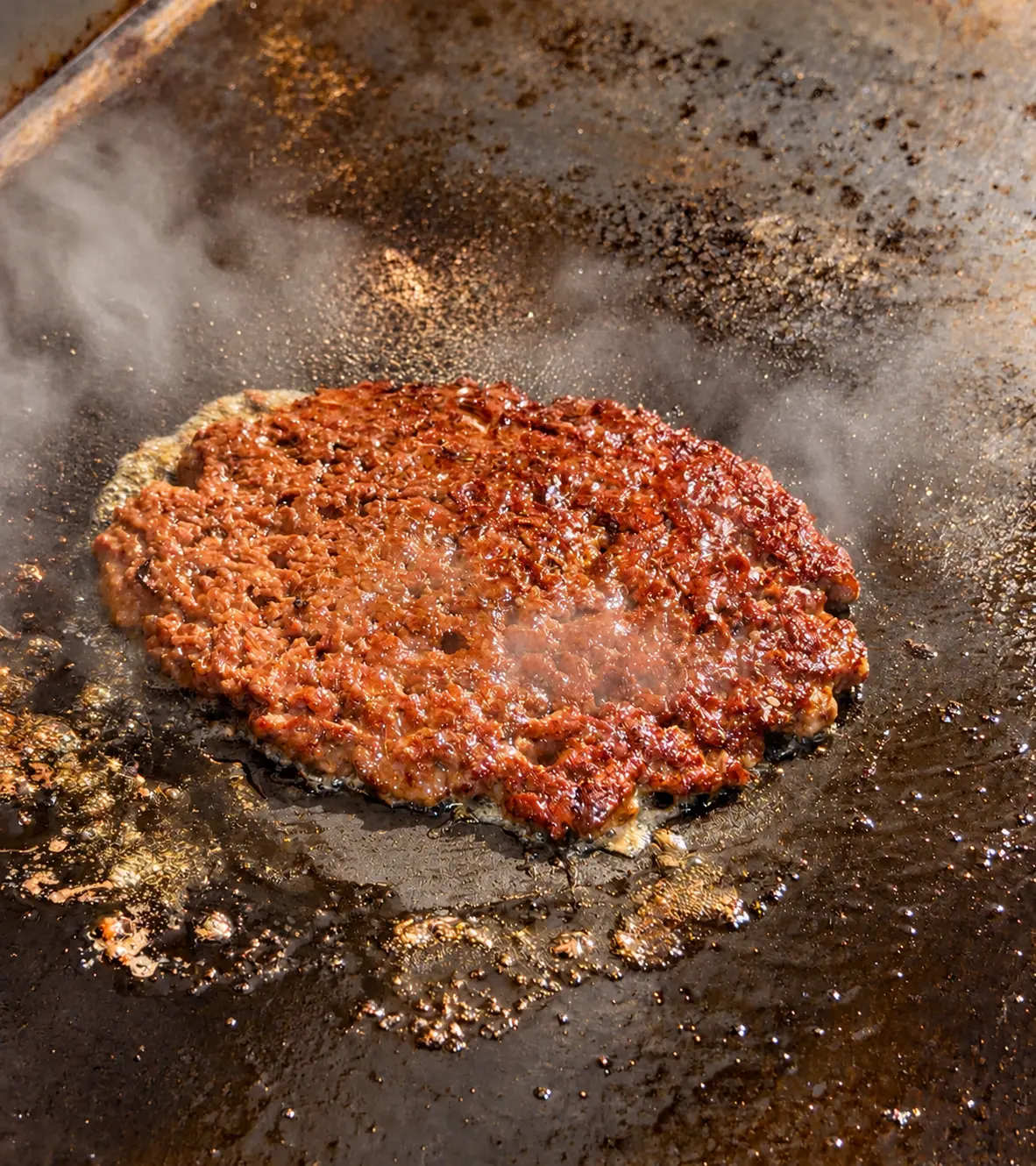 Smashburger patty developing a crisp crust on the ONE Burger grill